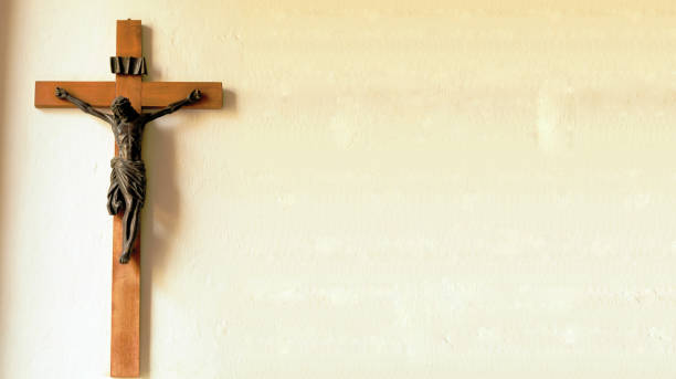 Crucifix on wall of old church (panorama)