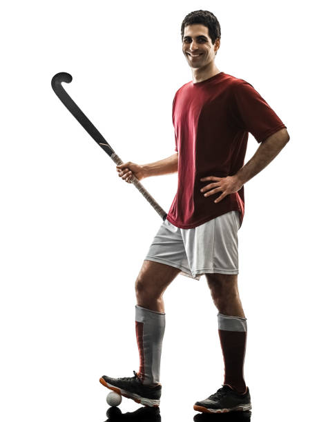 istock field hockey player man isolated silhouette white background 937316826