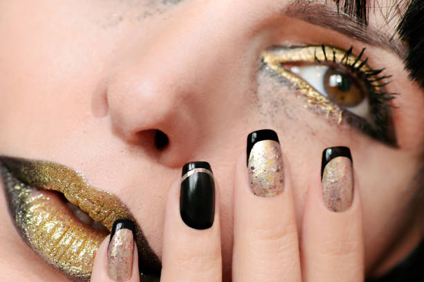 Black gold make-up and manicure.