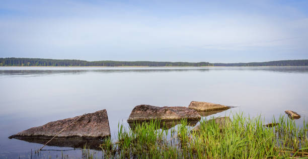 istock Three stones and the smooth surface of water 937318532