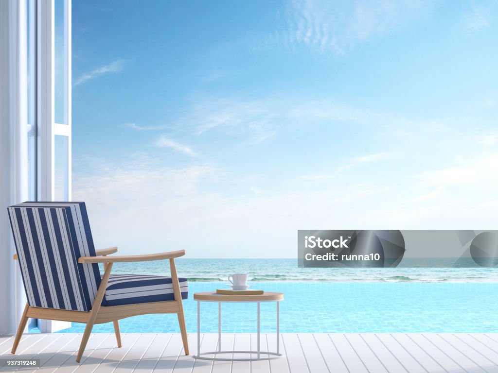 White pool villa terrace 3d render White pool villa terrace 3d render.There white wooden floor. Furnished with white and blue chair There are large open doors overlooks to borderless swimming pool and sea view. Beach Stock Photo