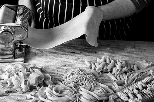 Woman making homemade pasta.