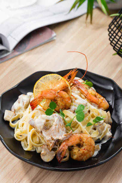 istock Pasta Tagliatelle with prawns and chanterelles mushrooms 937326180