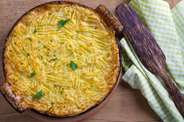 istock Shepherd pie - popular dish in Ireland. Beef meat, mashed potato, cheese, carrot, onion and green peas casserole 937330806