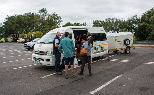Hoedspruit,South africa,06-03-2014:people and a van for travel in south africa,south africa is famous of the wild animals and the kruger national park with safari trips between the big 5