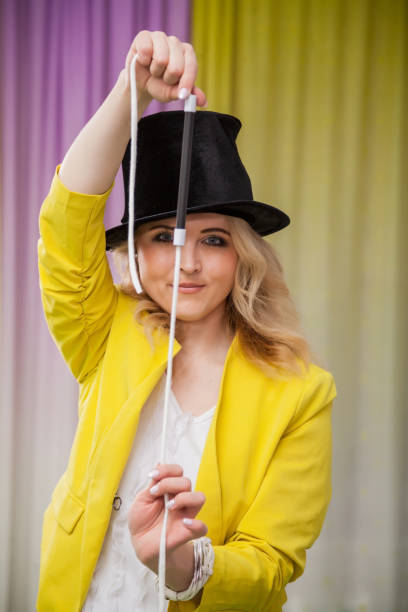 istock Woman magician shows tricks 937342874