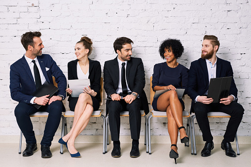 Happy business people waiting for job interview