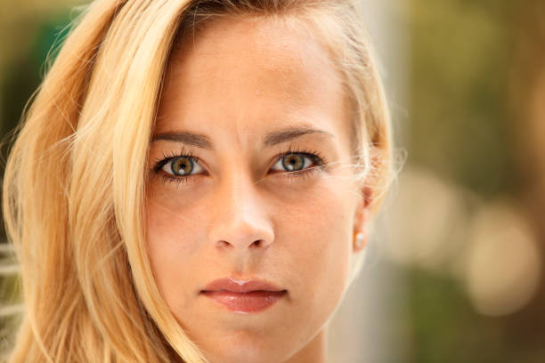 Close-up of a beautiful woman's face looking at viewer.