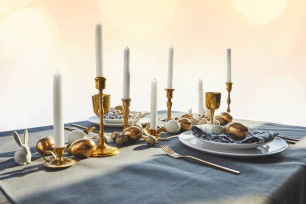 istock golden chicken eggs and candles on festive table 937350620