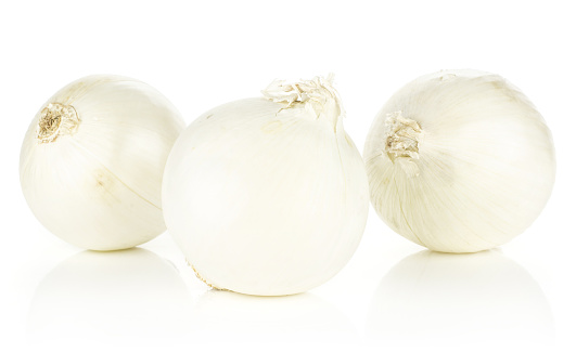 White onion three shiny and fresh pearls isolated on white background