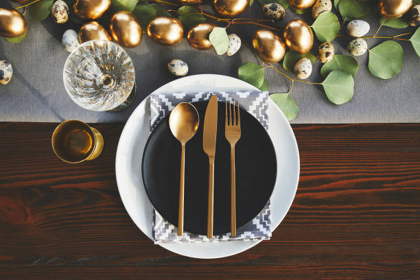 istock top view of golden utensil on easter decorated table 937351592