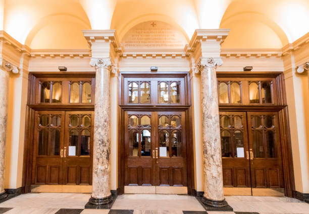 istock Large wooden doors and marble columns 937351934
