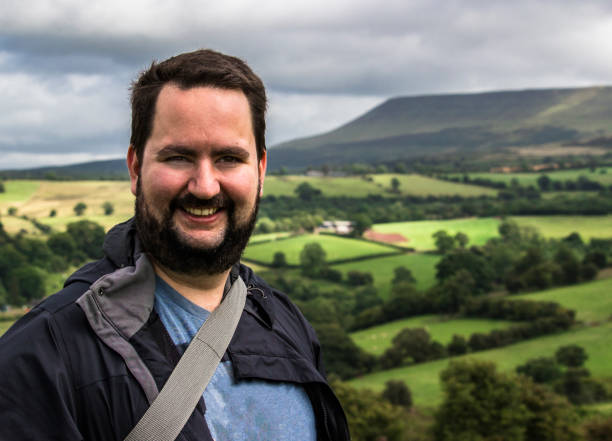istock white Man walking in the countryside 937352240
