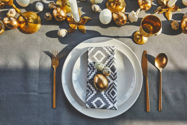 istock top view of golden egg and quail eggs on plates in restaurant, easter concept 937358724