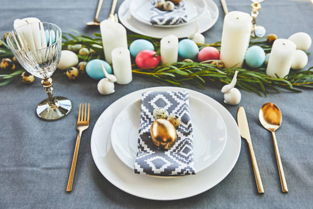 istock easter eggs and candles on festive table in restaurant 937359488
