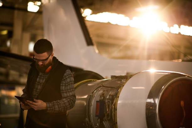 istock Aircraft mechanic in the hangar 937359648