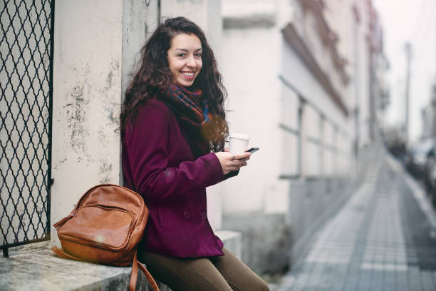 istock Girl using smart phone outdoors. 937359684