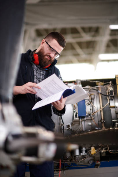 istock Aircraft mechanic in the hangar 937359840