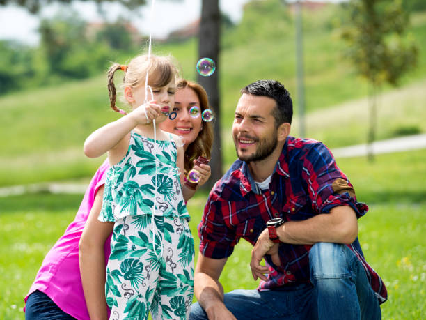 istock Parents enjoy in park with his daughter 937360218