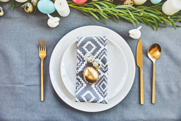 istock top view of golden easter egg and quail eggs on festive plates in restaurant 937360704