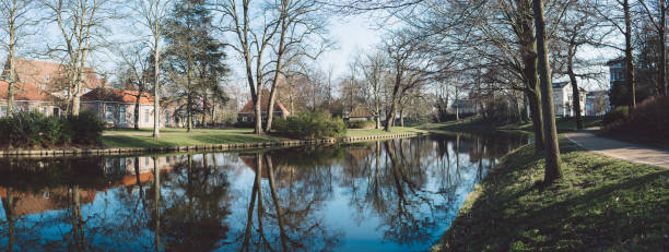 istock Reflection Of Trees In Lake Against Sky 937365396