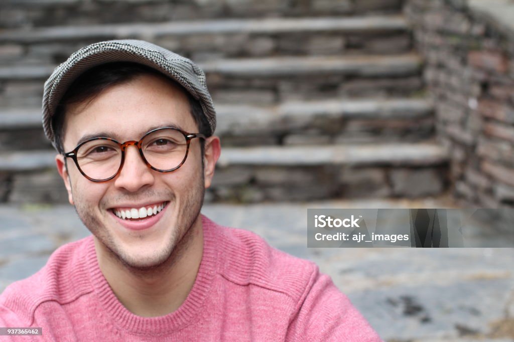 Hip man smiling wearing eyeglasses and hat Hip man smiling wearing eyeglasses and hat. Men Stock Photo