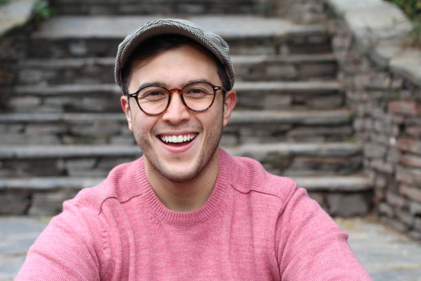istock Hip man smiling wearing eyeglasses and hat 937370098