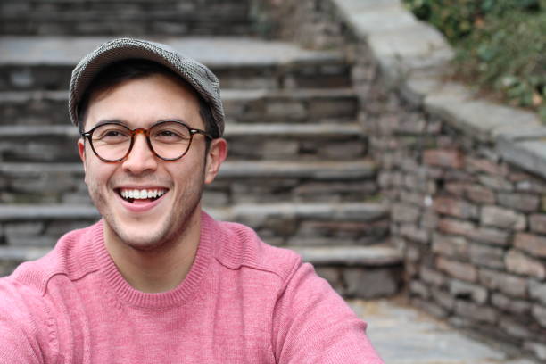 istock Hip man smiling wearing eyeglasses and hat 937374038