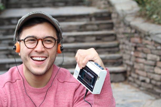 istock Ethnic male listening to a cassette 937374330
