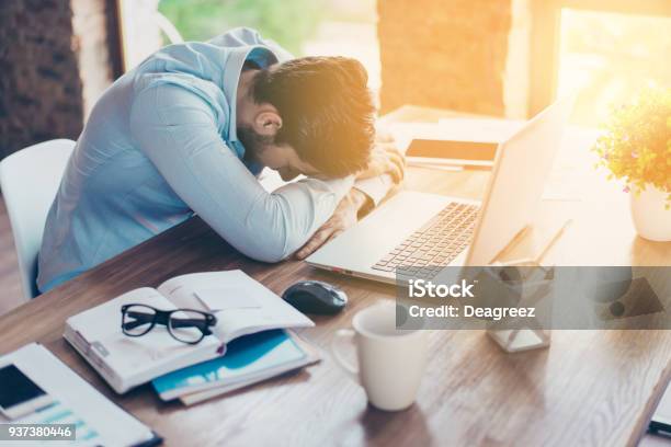I Need A Vacation Close Up Top View Portrait Of Tired Sick Young Brunet Guy He Is Wearing The Formalwear Resting At The Workplace Stock Photo - Download Image Now