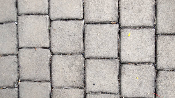 istock pavement Background of grey cobble stones 937383948
