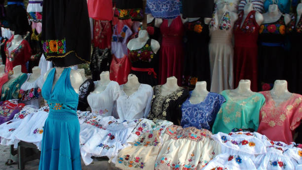 mexican traditional colorful clothing market stall scene in mexico - mexico dress market clothing imagens e fotografias de stock