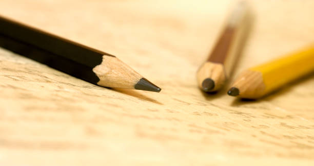 istock Calligraphy concept - pencils on handwritten letter 937392076