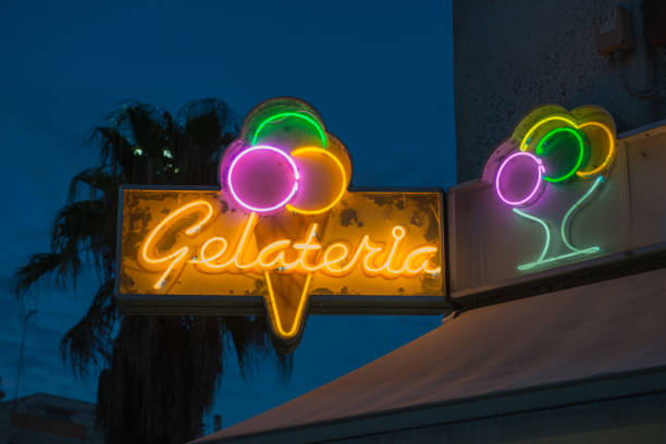 Neon Ice Cream A dated neon Gelato sign shines brightly. neon sign ice cream stock pictures, royalty-free photos & images