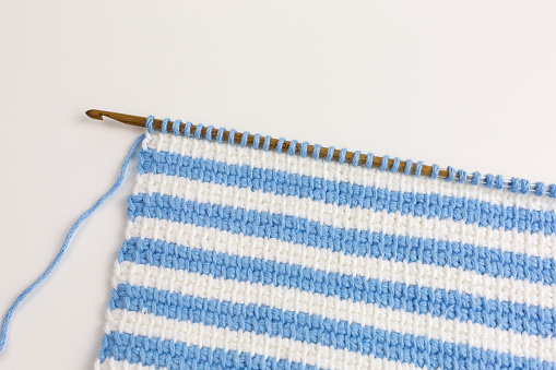 striped background of tunisian crochet fabric in basic stitch