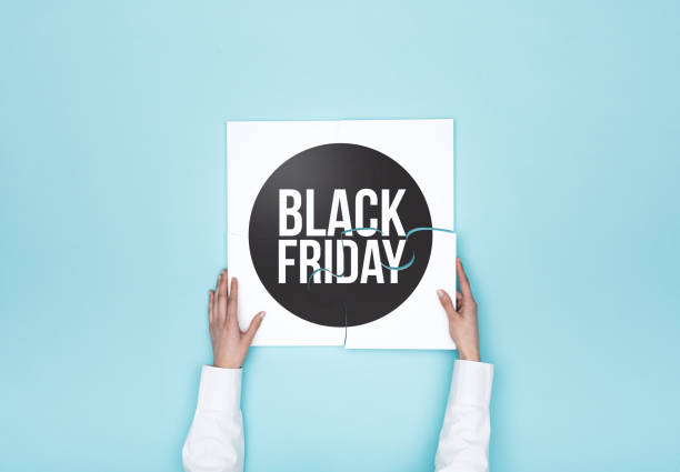 istock Woman completing a puzzle with a black friday badge 937411040