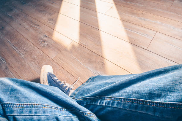 istock Hipster in jeans and sneakers, first person view 937412692