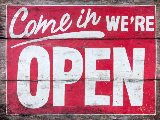 istock Come in we're OPEN - handpainted sign on wood, old. No background. 937415820