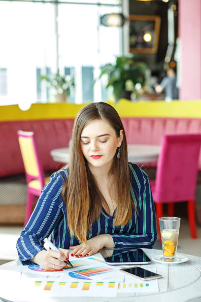 istock Creative woman designer works remotely. The concept of work, bus 937416422