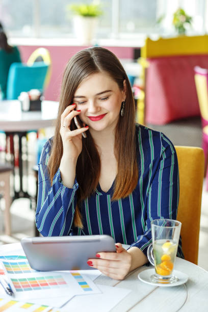 istock The young freelancer takes orders on the mobile. The concept of 937416480