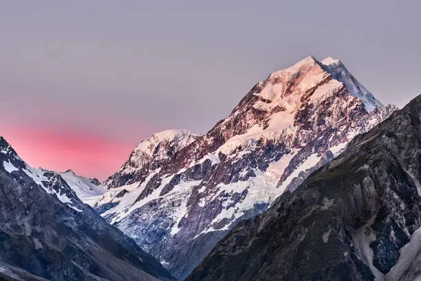 Beautiful pink cloud and golden mountain top view when sunset, mountain cook, New Zealand.