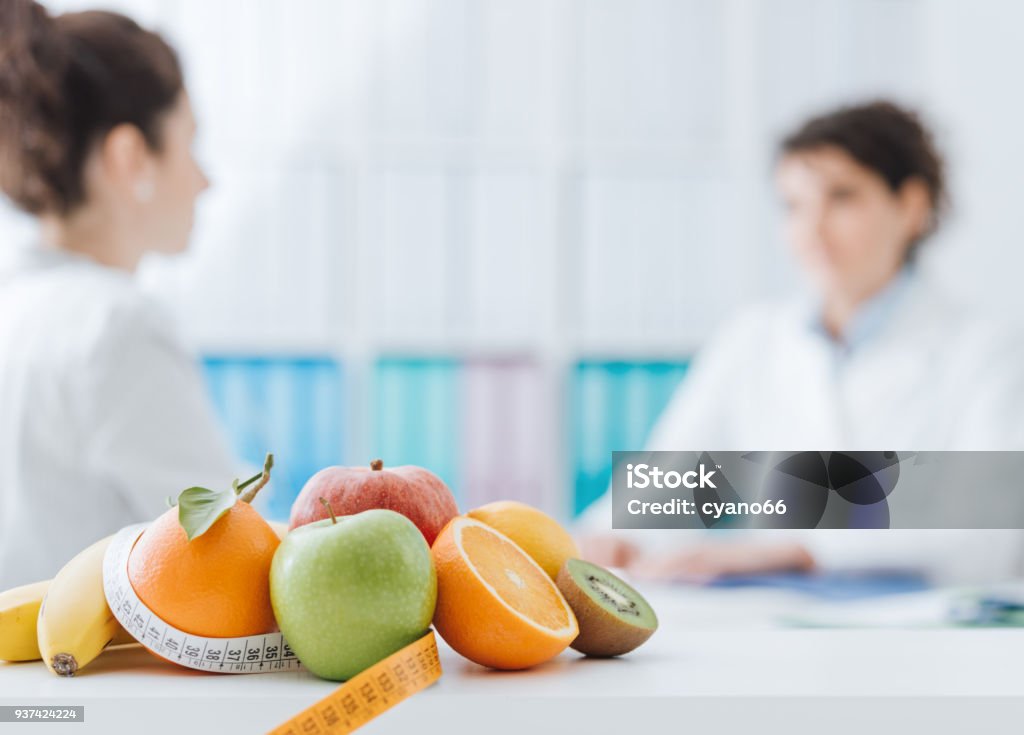 Nutritionniste, un patient dans le Bureau de la réunion - Photo de Nutritionniste libre de droits