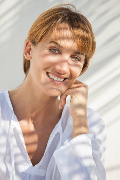 istock beautiful woman in the sun 937428140
