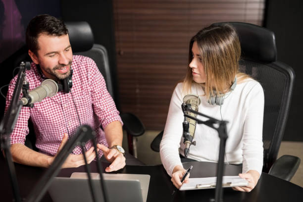 istock Presenters hosting show for radio live in Studio 937431092