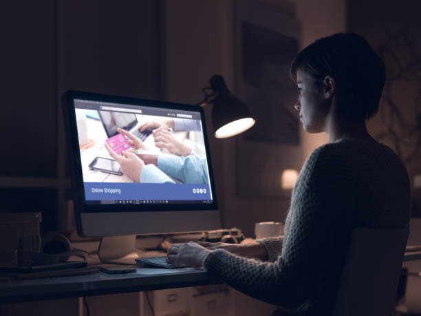 istock Woman shopping online at night 937433382