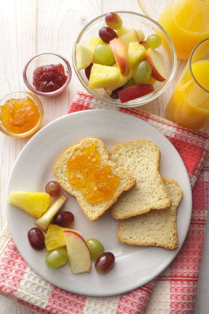 istock Breakfast: Toast, Fruit Salad and Orange Juice Still Life 937435290