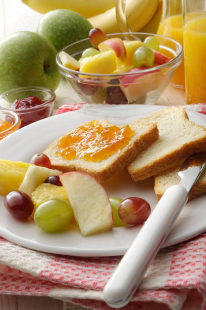 istock Breakfast: Toast, Fruit Salad and Orange Juice Still Life 937435308