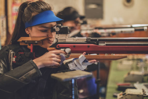 istock Girls on sport shooting training 937436110