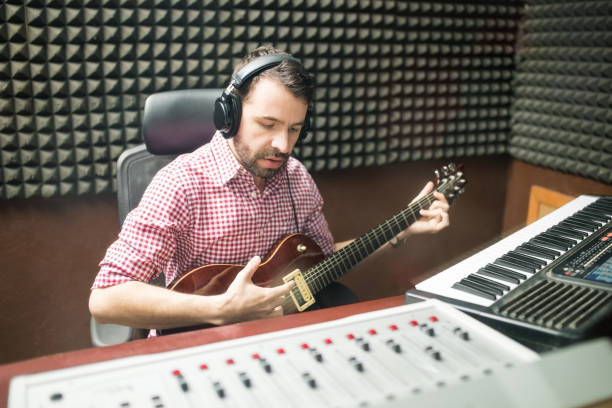 istock Hispanic musician composing music in his studio 937438552