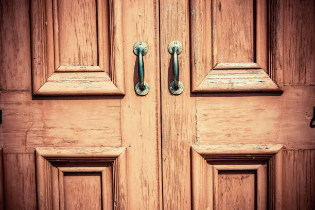 istock Handles on dyed wooden doors. 937440220